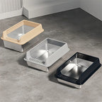 Bacs à litière en inox avec rebords beige, gris et noir, présentés côte à côte.